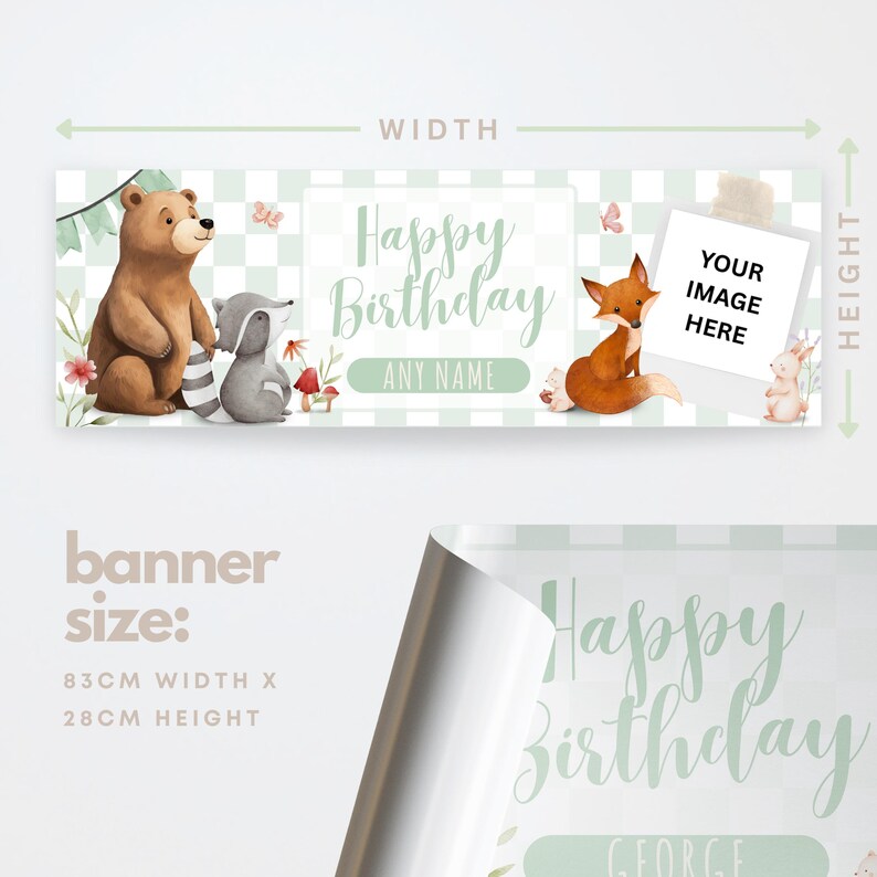 May include: A birthday banner with a woodland theme, featuring a bear, fox, raccoon, and rabbit. The banner has a light green and white checkered background and includes the text "Happy Birthday" and space for a name. The banner is 83cm wide and 28cm high.
