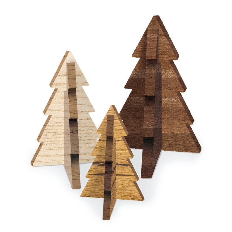 May include: Three wooden Christmas tree ornaments in different sizes and shades of brown. The largest tree is dark brown, the medium tree is light brown, and the smallest tree is a light wood color.