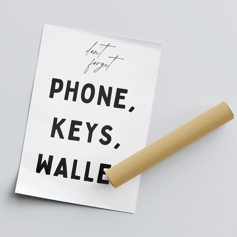 May include: A white poster with black text that reads "don't forget PHONE, KEYS, WALLE"