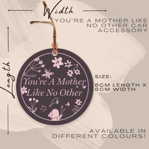 May include: A round, dark gray ceramic ornament with a pink floral design and the text "You're A Mother Like No Other". The ornament is 6 inches in diameter and comes in various colors.