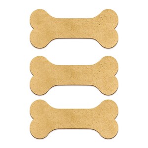 May include: Three brown cardboard dog bone shapes, stacked on top of each other.