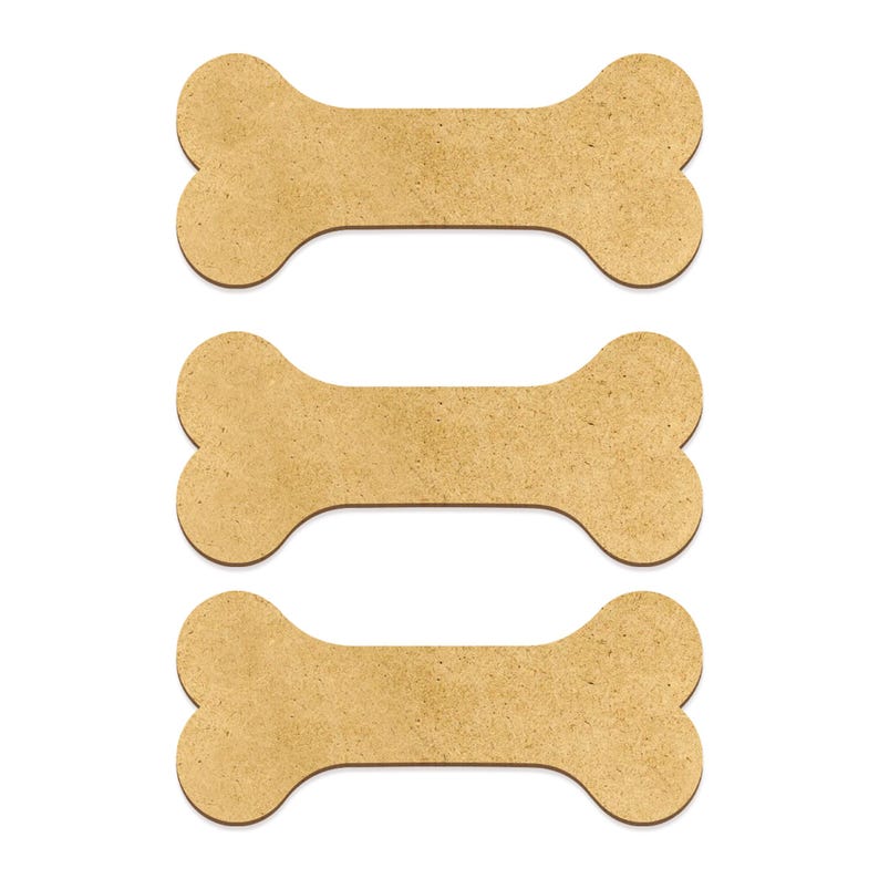 May include: Three brown cardboard dog bone shapes, stacked on top of each other.