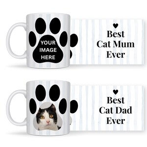 May include: White ceramic mugs with a black paw print design. One mug has the text "YOUR IMAGE HERE" inside the paw print. The other mug features a black and white cat. The text "Best Cat Mum Ever" and "Best Cat Dad Ever" are also displayed.