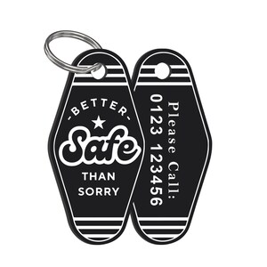 May include: Black and white motel key chain with the text "Better Safe Than Sorry" and a star on one side and a phone number on the other side. The text "Please Call: 0123 123456" is printed on the other side.