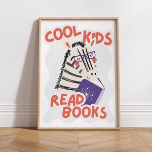 May include: A white and black zebra wearing glasses and reading a purple book with an atom symbol on the cover. The text "COOL KIDS READ BOOKS" is in red letters.