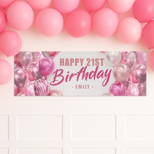 May include: A banner with the text "HAPPY 21ST BIRTHDAY - EMILY -" in pink, surrounded by pink and silver balloons. Pink balloons are also arranged at the top of the image.