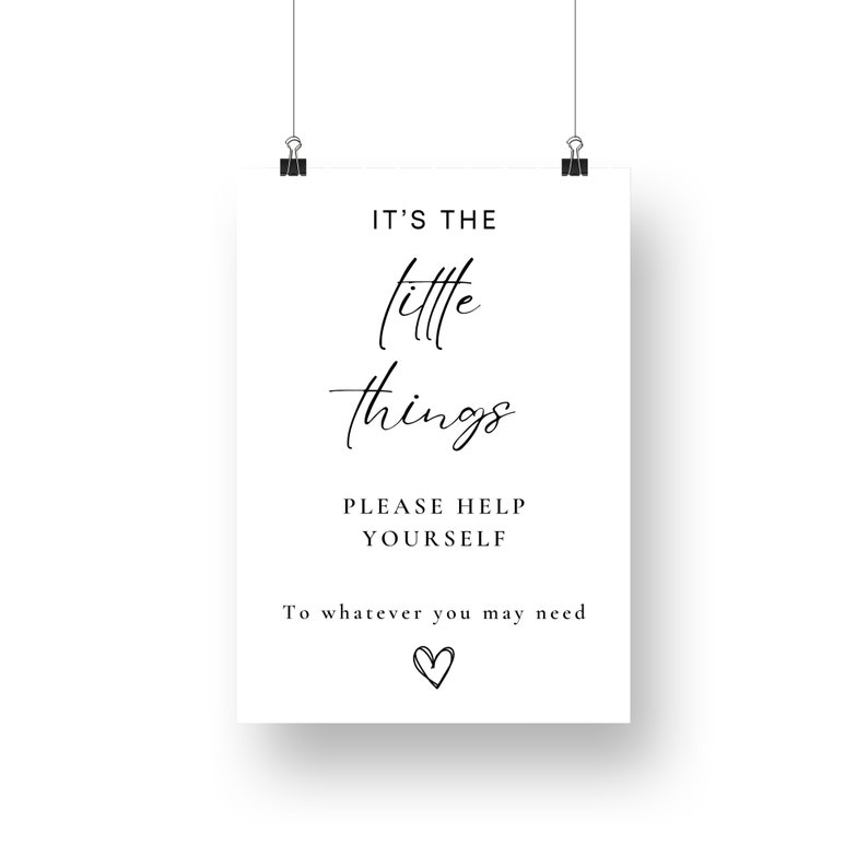 May include: A white sign with black text that reads "It's the little things. Please help yourself to whatever you may need." A small heart is drawn at the bottom of the sign.