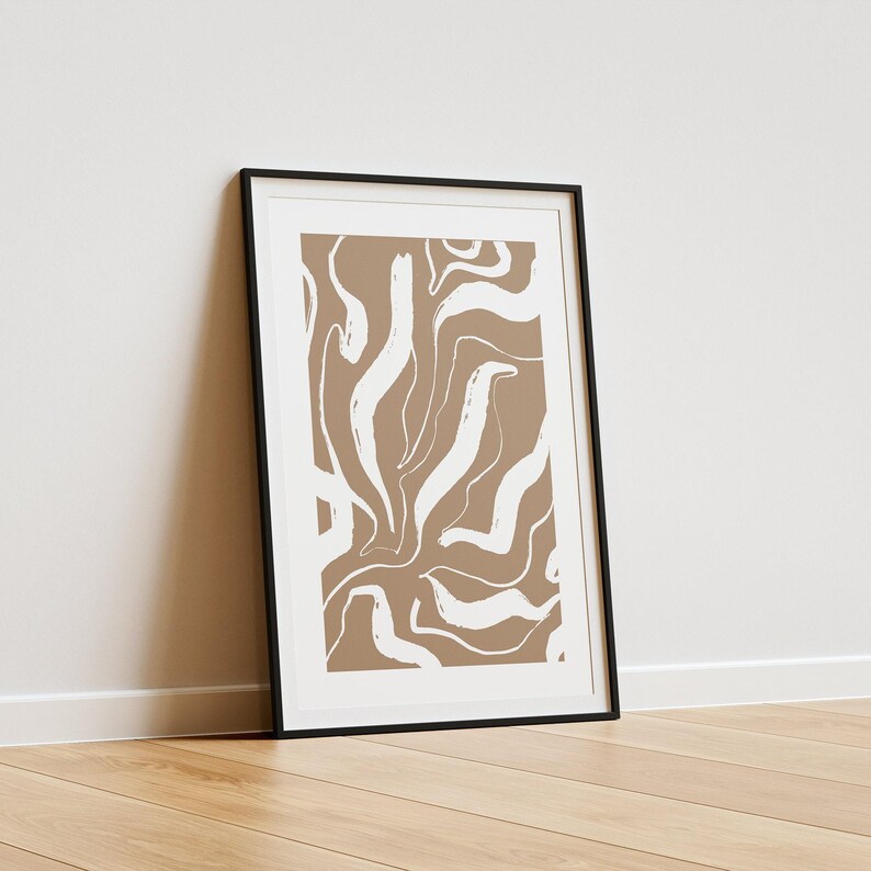 May include: A framed print with a brown background and white abstract lines. The print is in a black frame.
