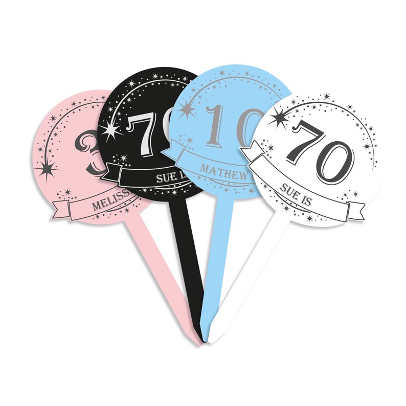 May include: Four round cake toppers with silver glitter and stars. The toppers feature the numbers 70, 30, 10, and 70 with the names Sue, Melissa, Matthew, and Sue Is written on each topper.