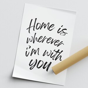 May include: A white card with black calligraphy that reads "Home is wherever I'm with you".