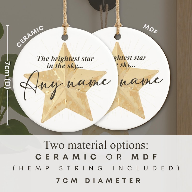 May include: Two white ceramic or MDF star-shaped ornaments, 7cm in diameter, with hemp string. Each ornament features a gold star design and the text "The brightest star in the sky... Any name".