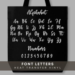 May include: Black tote bag featuring the alphabet and numbers in a white, cursive font. The bag also includes the text "FONT LETTERS HEAT TRANSFER VINYL" in white. The design is simple and clean.