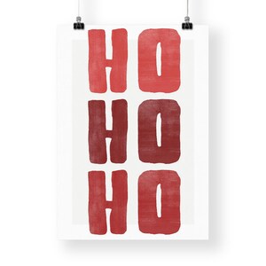 May include: A white poster with the words "HO HO HO" in a bold, red, block-letter style. The letters are arranged in three rows of two, with each word stacked vertically. The design has a festive, holiday theme.