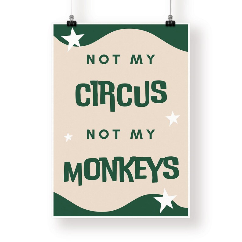 May include: A beige poster with green and white accents. The poster features the text "Not my circus, not my monkeys" in a bold, green font. The poster is decorated with white stars.