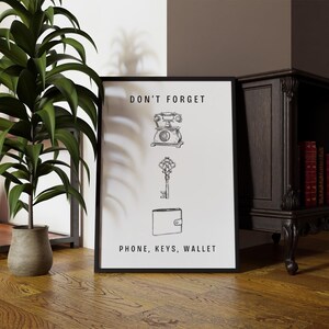 May include: Black and white illustration of a phone, key, and wallet with the text "Don't forget Phone, Keys, Wallet".