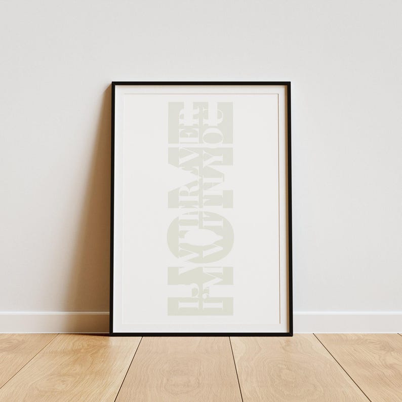 May include: A black framed print with the word "HOME" written in white letters, with the letters stacked vertically.