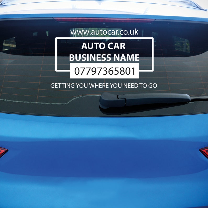 May include: A white sticker on the back window of a blue car. The sticker says "AUTO CAR BUSINESS NAME" and includes a phone number and website address. The text below the sticker says "GETTING YOU WHERE YOU NEED TO GO."