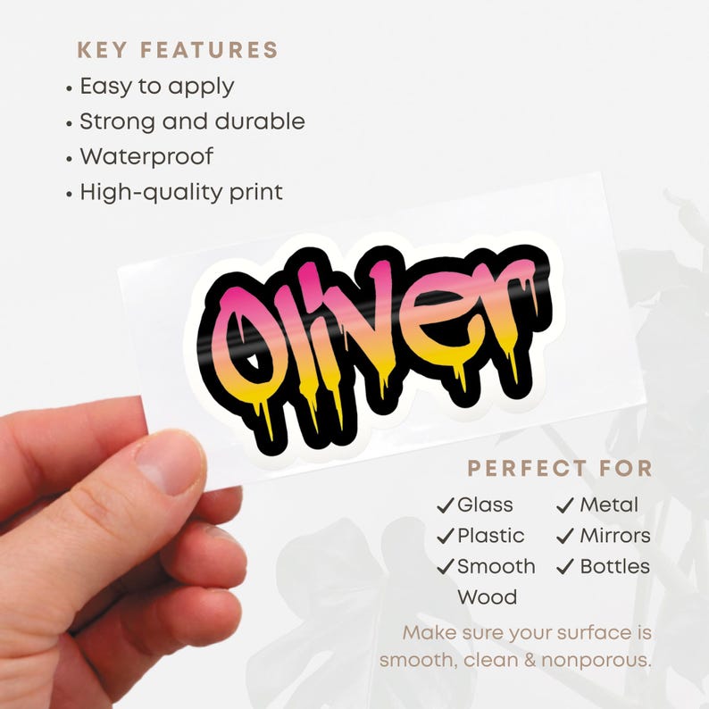 May include: A sticker with the name "Oliver" in a graffiti-style font, featuring a gradient of pink and yellow with black outlines. The sticker is shown against a white background. The text "Key Features" and "Perfect For" are also visible.