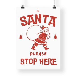 May include: Red and white vintage-style Christmas sign with the text "SANTA PLEASE STOP HERE" and a cartoon image of Santa Claus carrying a bag of gifts.