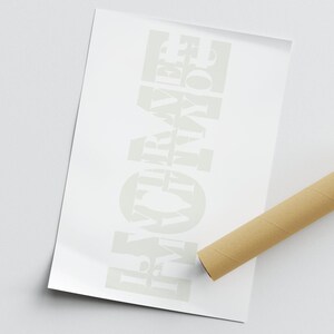 May include: White print on a white background that reads "HOME IS WHERE THE LOVE IS".