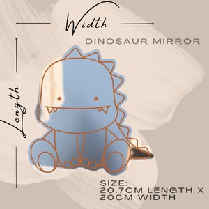 May include: A blue dinosaur-shaped mirror with a cute cartoon face. The mirror is 20.7 inches long and 20 inches wide.  The text "Dinosaur Mirror" is printed above the mirror.