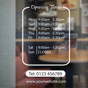 May include: A white sign with black text on a glass door, listing the business's opening hours. The sign says "Opening Times" and lists the hours for each day of the week. The sign also includes the business's phone number and website address. The phone number is 0123 456789 and the website address is www.yourwebsite.com.