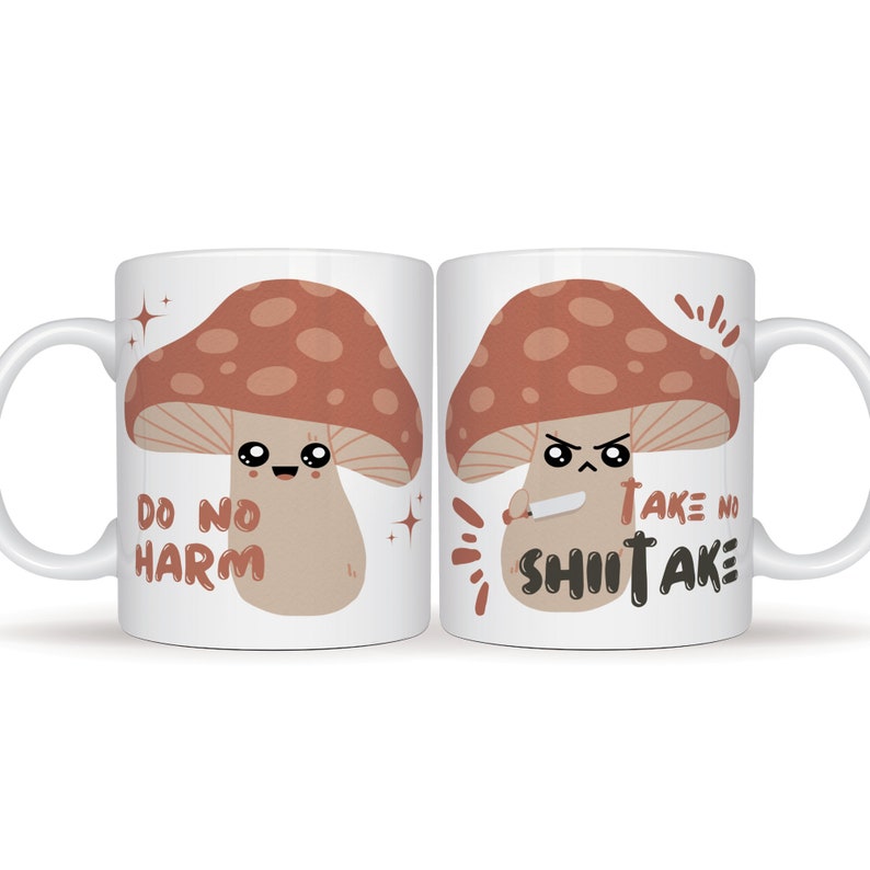 May include: Two white mugs with a mushroom design. One mug says "Do No Harm" and the other says "Take No Shiitake".
