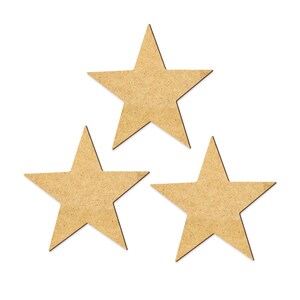 May include: Three brown cardboard stars, each with five points, are arranged in a triangular pattern on a white background.