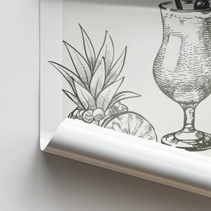 May include: Black and white line drawing of a pineapple, a slice of orange, and a cocktail glass with a straw and a cherry on top.