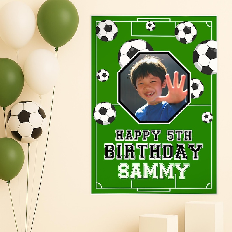 May include: A green soccer-themed birthday banner with the text "HAPPY 5TH BIRTHDAY SAMMY." The banner features a photo of a smiling child, soccer balls, and a soccer field design. Balloons in white and green are in the background.
