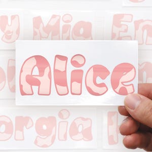 personalised pink cow print sticker custom name decal vinyl lettering aesthetic western cowgirl bubble font name label water bottle sticker laptop decal personalised glossy name sticker custom vinyl name no background trendy pink sticker mirror name decal phone case name sticker planner name label gift idea for her him teenager adults