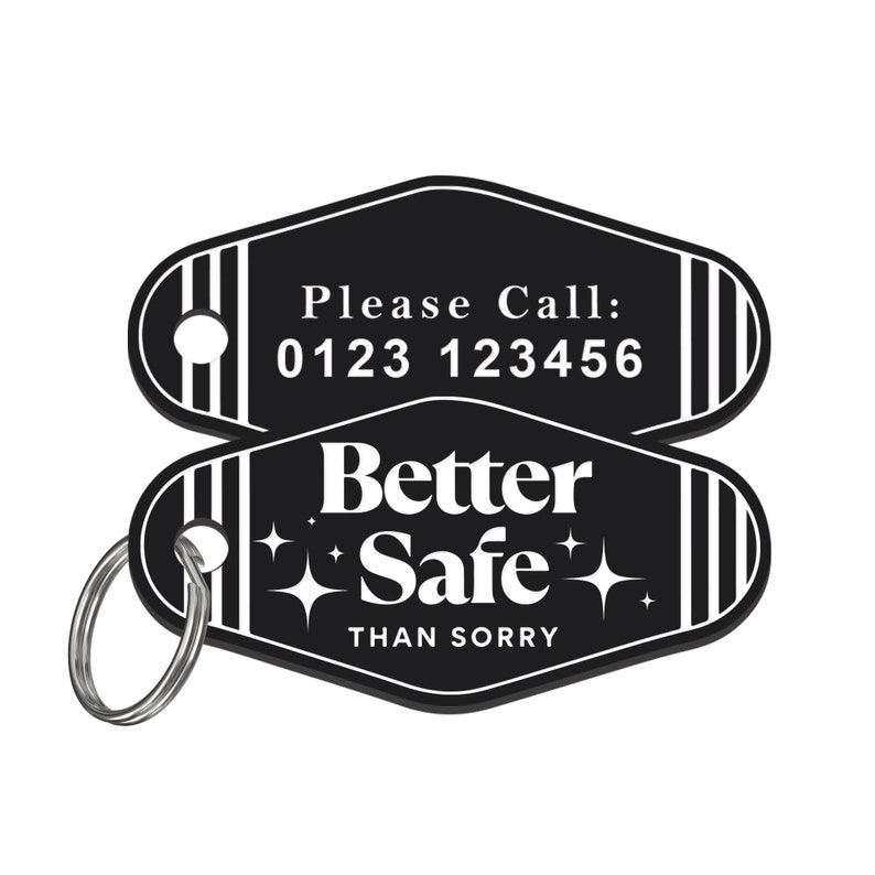 May include: Black motel key tag with white text that reads "Please Call: 0123 123456" on the top and "Better Safe Than Sorry" with two white stars on the bottom. The key tag has a silver key ring.