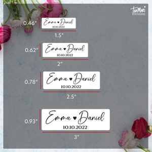 May include: Five white rectangular labels with black text and a small heart symbol. The labels are different sizes, measuring 0.46 inches, 0.62 inches, 0.78 inches, and 0.93 inches. The text on the labels reads "Emma Daniel 10.10.2022".