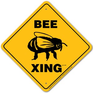 May include: Yellow diamond-shaped warning sign with black text and a black silhouette of a bee. The sign reads "BEE XING".