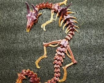 Articulated Skeleton Dragon designed by @doll_maker_spb 3d printed dragon flexy flexi dragon