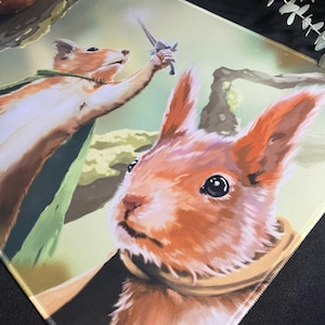 May include: Two red squirrels, one holding a sword, the other looking up with a surprised expression. The background is a green and brown forest scene.