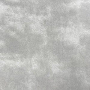 May include: A close-up view of a textured, light gray fabric. The surface has a soft, cloudy appearance with subtle variations in tone, creating a gentle, diffused effect. The fabric's texture is visible throughout the image.