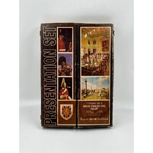 May include: A brown box with a gold label that says "Presentation Set". The box has images of guards in red uniforms and a view of a city. The label also says "5 Complete Sets of English Stainless Steel Cutlery" and "Regent British Sheffield".