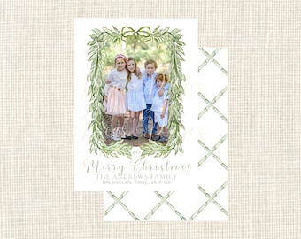 May include: Christmas card with a family photograph framed by a green watercolour wreath. The card reads "Merry Christmas" and includes the family name and children's names. A matching patterned design is on the reverse.
