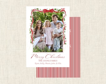 May include: A Christmas card featuring a family portrait within a red and green decorative frame. The card includes the text "Merry Christmas" and the family name, "The Lyons Family."