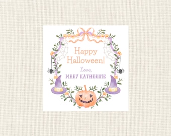 May include: Square Halloween-themed card with a watercolor design. The card features a wreath of green leaves, purple accents, and orange accents. The text reads "Happy Halloween!" with a personalized name below. Includes a jack-o'-lantern, witch hats, and spiders.