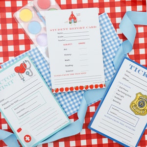 May include: Three printable cards with a schoolhouse, doctor, and police officer theme. The cards are designed for kids to fill out with information for a pretend school, doctor's visit, or police stop. The cards are on a red and white checkered background.