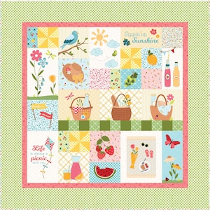 May include: A patchwork quilt with a picnic theme. The quilt features squares with images of a bluebird, sun, picnic baskets, strawberries, and the text "Sippin' on Sunshine" and "Life is always a picnic with you."