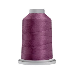 May include: A spool of deep purple thread for sewing or embroidery.