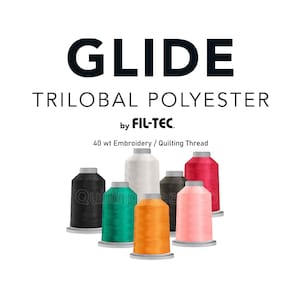 May include: Image of several spools of Glide Trilobal Polyester thread in various colors, including black, green, orange, pink, and red. The text "GLIDE" and "TRILOBAL POLYESTER" are displayed above the spools, with "by FIL-TEC" below.