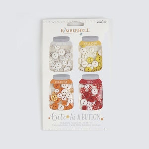 May include: A package of 96 white, yellow, orange, and red buttons in two sizes. The buttons are packaged in four clear jars with labels that say "White", "Yellow", "Orange", and "Red". The package also includes the text "Cute as a Button" and "Patterns Included: Solid, White Polka Dot, Gingham".