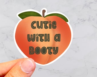 Cutie met een buitsticker, perziksticker, kontperzik, emojisticker, grappige sticker, plannersticker, waterflessticker, perziken