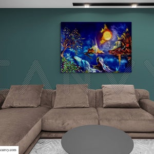 May include: An abstract landscape painting with a vibrant color palette of blues, yellows, and greens. The artwork depicts a moonlit scene with a body of water, trees, and mountains. The painting hangs above a brown sectional sofa.