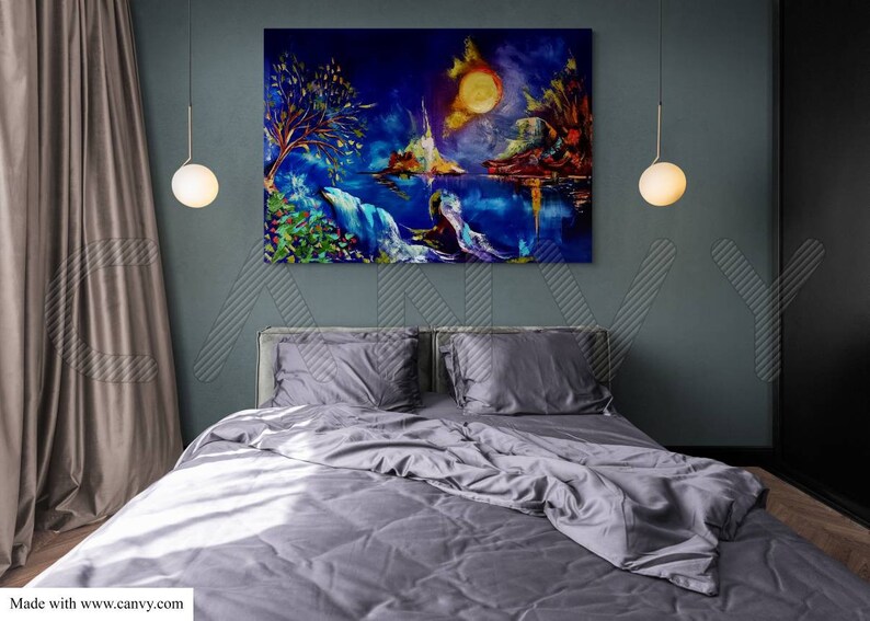 May include: A large, colorful landscape painting hangs above a bed with gray bedding. The artwork depicts a vibrant scene with a bright yellow sun, mountains, and a body of water. Two spherical pendant lights hang on either side of the painting.