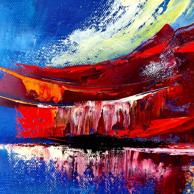 May include: Abstract landscape painting with bold brushstrokes. The artwork features a vibrant color palette of deep reds, oranges, and blues, creating a dynamic and textured visual experience. The composition evokes a sense of depth and movement.